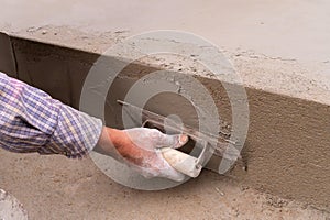 Indian labour plastering using trowel