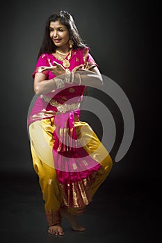 Indian lady performing traditional dance called Bharatnatyam