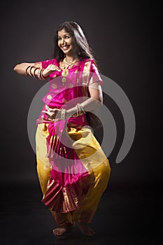 Indian lady performing traditional dance called Bharatnatyam