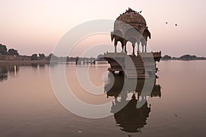 Indian landmarks - Gadi Sagar temple on Gadisar lake during sunr