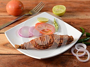 The Indian mackerel, Malwani Bangda fry, Fish fry.. on a rustic wooden background, selective focus