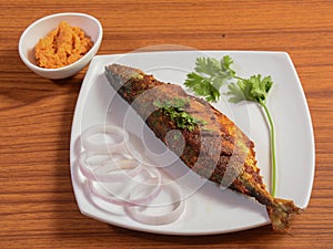 The Indian mackerel (Rastrelliger kanagurta) , Bangda fry, Fish fry.. on a rustic wooden background, selective focus