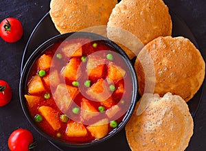 Indian main course- aloo matar and poori photo