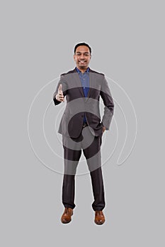 Indian Male Businessman offering hand to shake. Greeting and welcoming gesture. Business advertisement concept