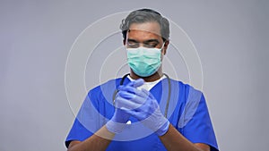 indian male doctor in uniform, mask and gloves