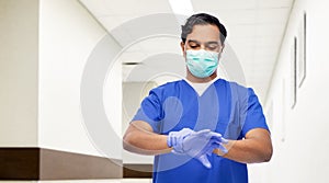 indian male doctor in uniform, mask and gloves