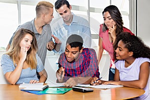 Indian male student with group of international students an teacher