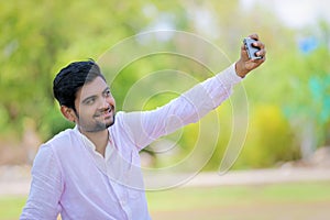 Indian man click selfie with mobile