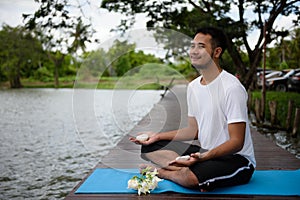 Indian man hand yoga with rock