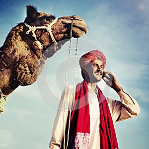 Indian Man On the Phone Camel Communication Concept