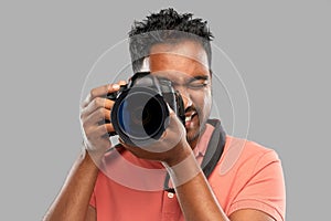 Indian man or photographer with digital camera