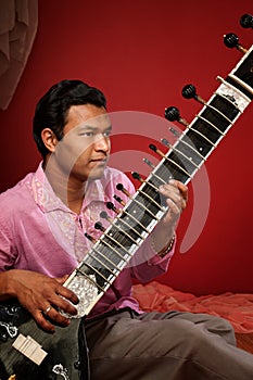 Indian Man Playing Sitar
