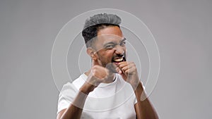 Indian man pretending fighting or boxing