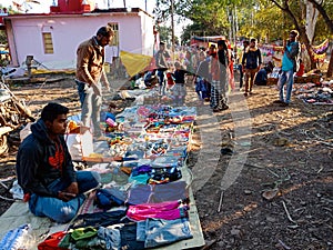 an indian man seating at street shop during fair program in India January 2020