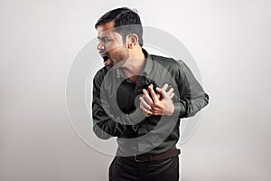 Young asian heart patient holding chest