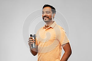 Indian man with thermo cup or tumbler for drink