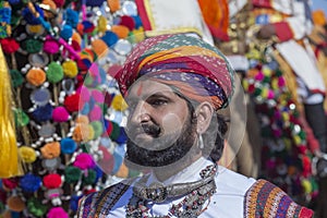 Indian man wearing traditional dress participate in mister desert contest of festival in Jaisalmer, Rajasthan, India