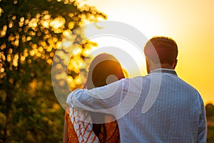 Indian Married couple embracing during the sunset