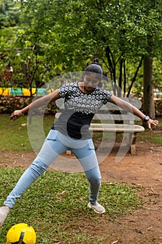 Indian Married Woman Playing football in Park jeans and t-shirt