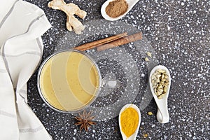 Indian masala tea, healthy drink with spices star anise, cinnamon, turmeric. Traditional organic drink flat lay