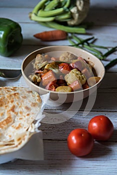 Indian meal aloo gobi or mixed vegetables and paratha or flat bread served and ready to eat.