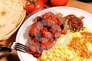 Indian meal biryani food with chicken masala and s