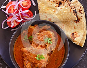 Indian Meal -Chicken curry with roti and salad