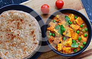 Indian meal- parantha and matar paneer curry photo