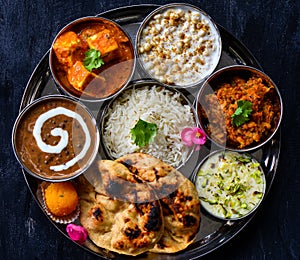 Indian meals served in stainless steel thaali plate