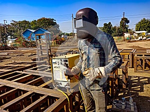 an indian mechanic making iron structure during railway bridge construction on site in India January 2020