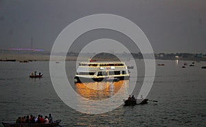 Indian Mel Tourist Votes floating in the famous river of Banaras