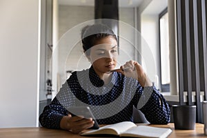 Indian millennial student girl preparing for exam, watching learning webinar