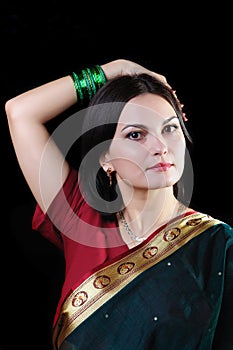 Indian mood. Portrait of a beautiful young woman posing in a sari dress.