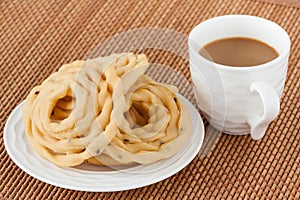 Indian murukku snack with coffee