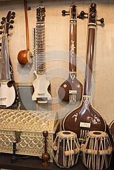 Indian musical instruments stringed guitars called sitars and Indian Folk percussion barrel shaped bass drums