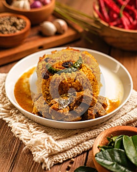 Indian Mutton Biryani Dish served on wooden table