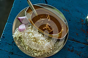 Indian mutton curry with rice at local dhaba in himalayas photo