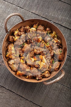 Indian mutton  fry-   cooked in iron skillet.