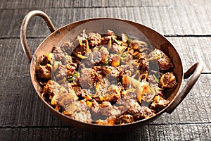 Indian mutton  fry-   cooked in iron skillet.