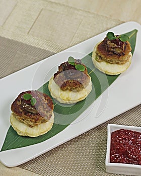 Indian mutton kebab with puff pastry, foie gras and strawberry sauce, fusion cuisine