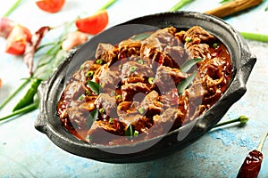 Indian mutton  rogan josh  cooked in earthenware.