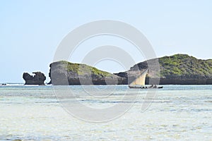 Indian ocean image dhow sailing past rocks
