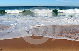 Indian Ocean waves rolling in at pristine Binningup Beach Western Australia on a sunny morning in late autumn.