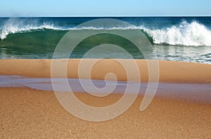 Indian Ocean waves rolling in at pristine Binningup Beach Western Australia on a sunny morning in late autumn.