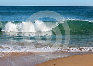 Indian Ocean waves rolling in at pristine Binningup Beach Western Australia on a sunny morning in late autumn.