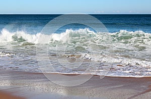 Indian Ocean waves rolling in at pristine Binningup Beach Western Australia on a sunny morning in late autumn.