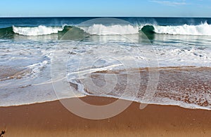 Indian Ocean waves rolling in at pristine Binningup Beach Western Australia on a sunny morning in late autumn. photo