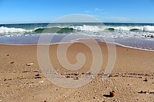 Indian Ocean waves rolling in at pristine Binningup Beach Western Australia on a sunny morning in late autumn.