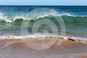 Indian Ocean waves rolling in at pristine Binningup Beach Western Australia on a sunny morning in late autumn. photo