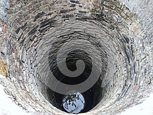 Indian old ancient medieval deep well rock bottom